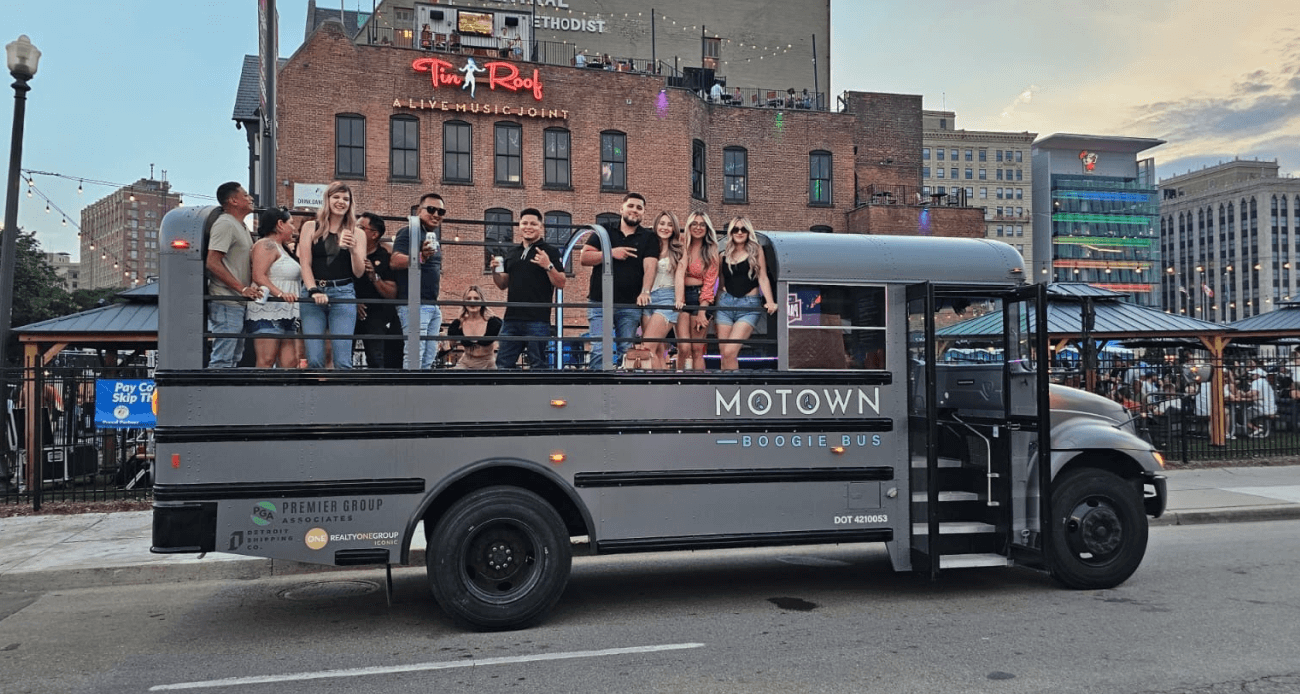 Motown Boogie Bus glowing under city lights