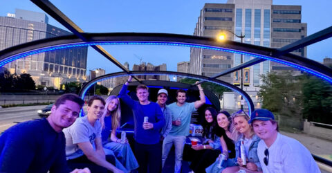 Motown Boogie Bus glowing under city lights