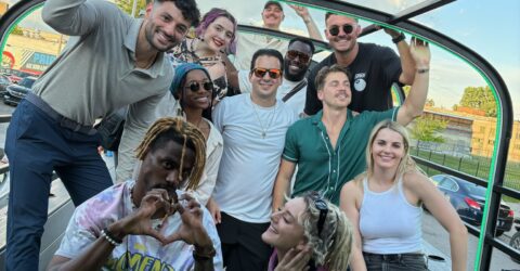 Motown Boogie Bus glowing under city lights