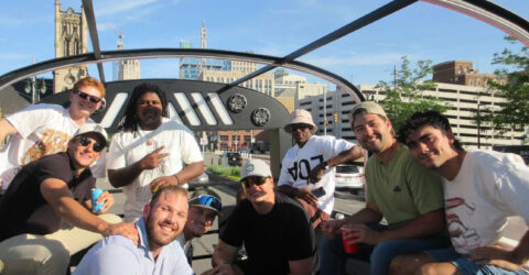 Motown Boogie Bus glowing under city lights