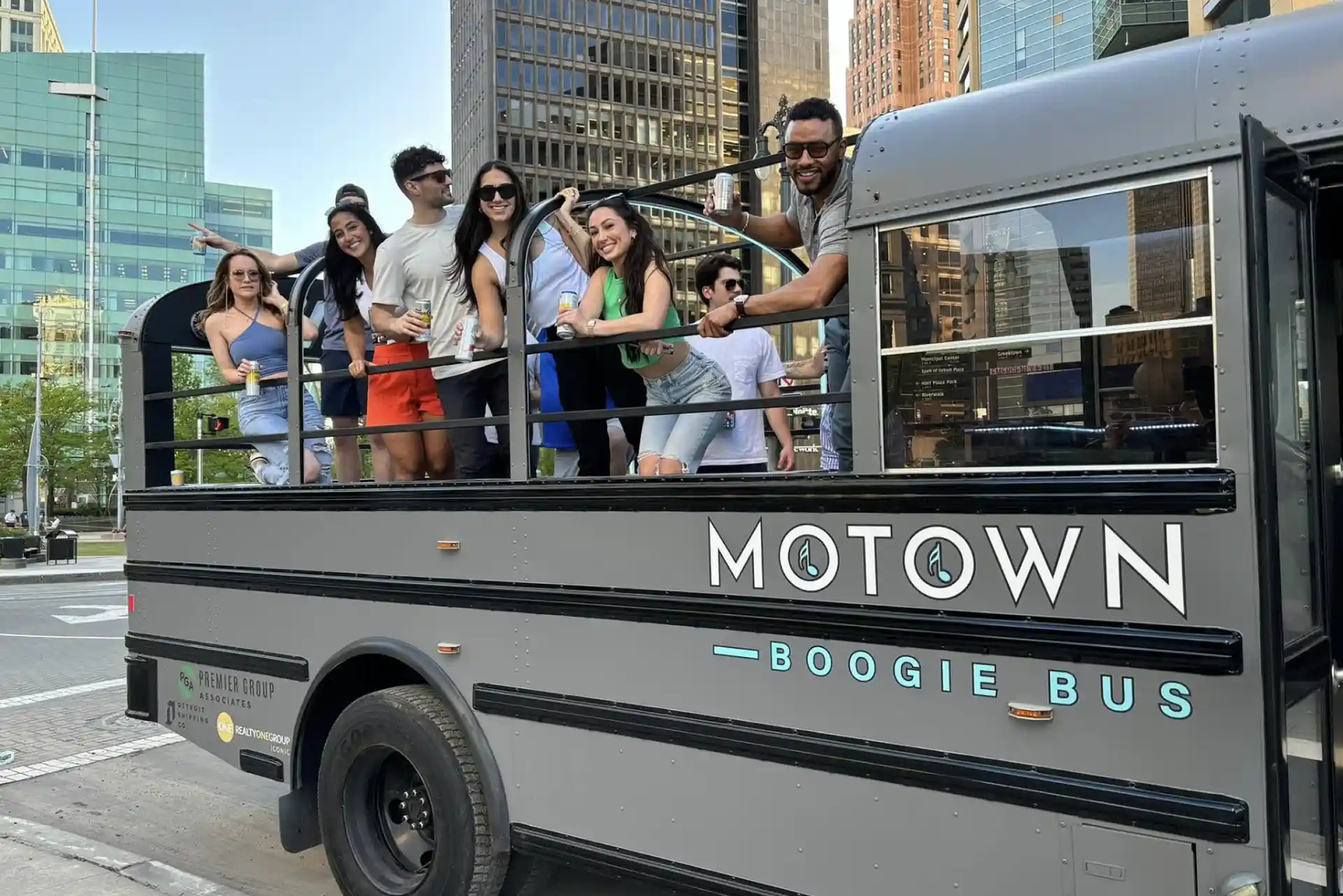 Friends celebrating on a party bus in Detroit