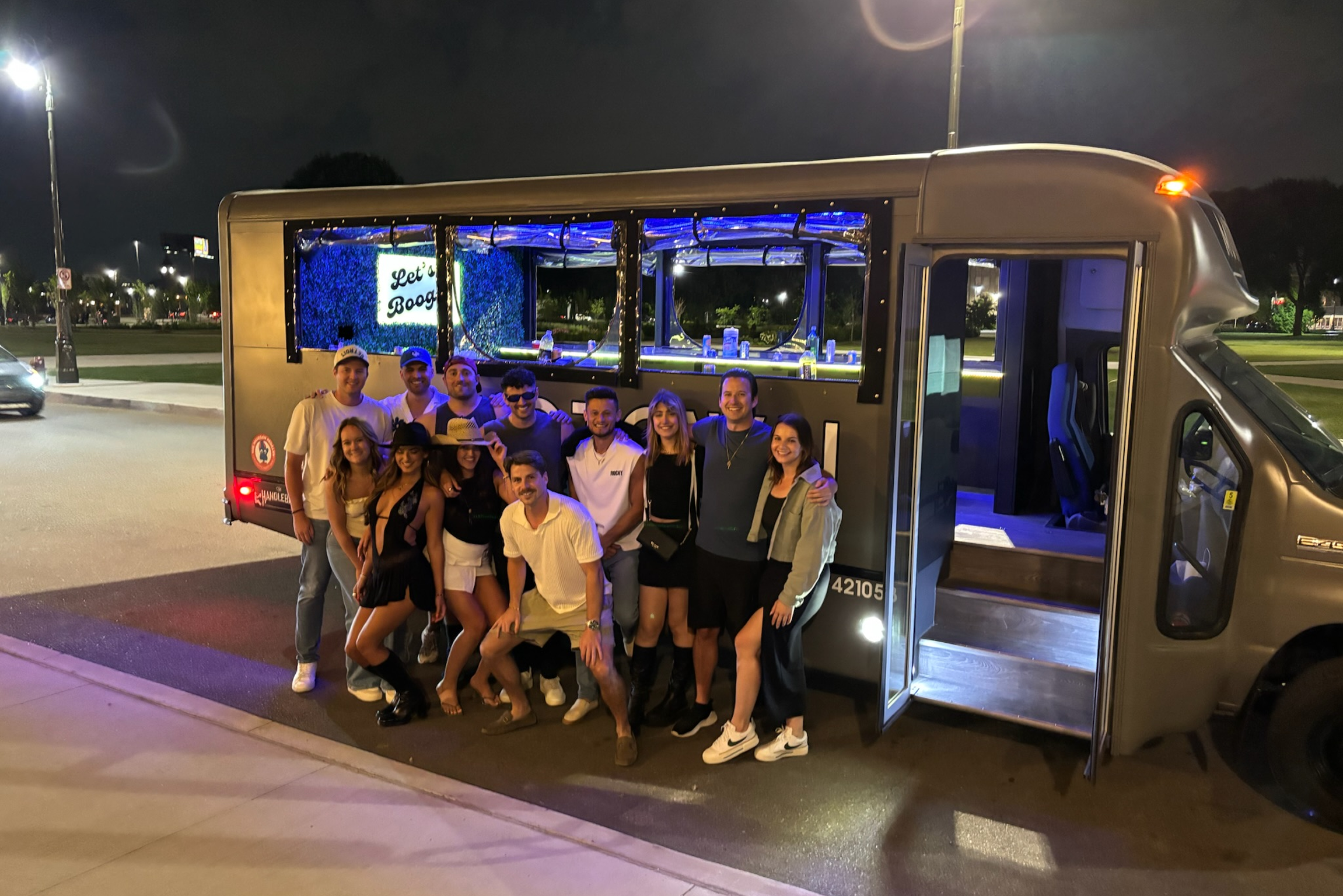 Friends celebrating on a party bus in Detroit
